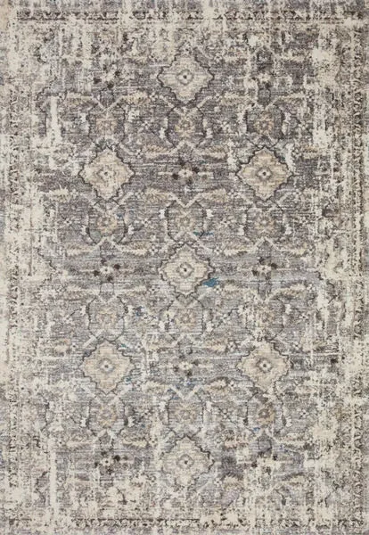 Top-down view showing full pattern of grey and natural rug with intricate transitional design