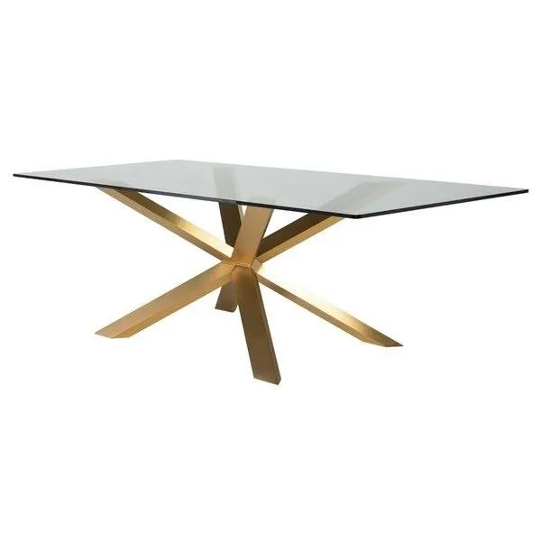 Couture Dining Table angled front view showing gold metal base structure and glass top thickness