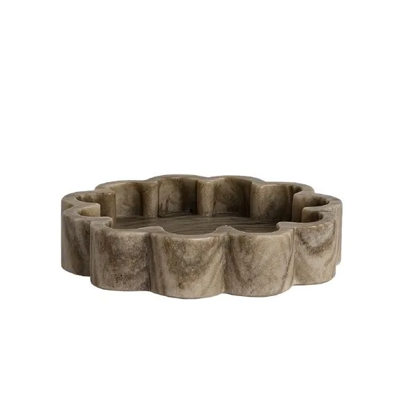 Organic shaped brown marble tray with ribbed texture and irregular scalloped edges