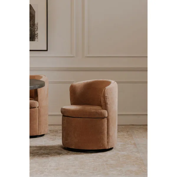 Dane swivel dining chair with heritage pink soft upholstery, curved backrest, and round swivel base