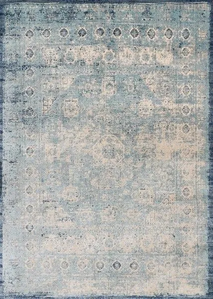 Rectangular traditional rug in light blue and ivory with distressed, ornate patterns and a dark blue border