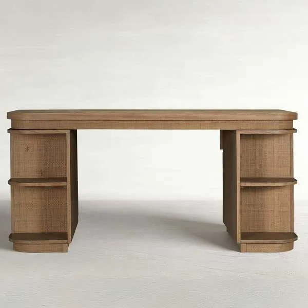 Blonde natural mindi wood desk with rattan panels and antique bronze hardware, featuring open side shelves