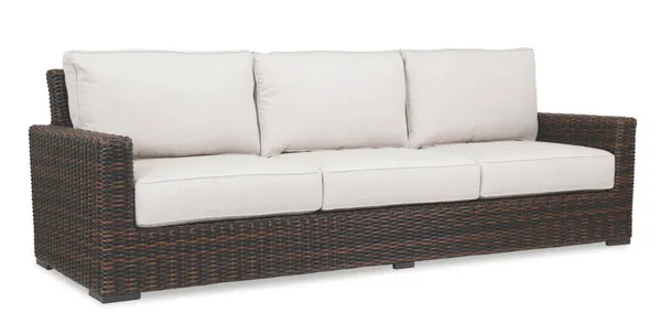 Montecito Sofa in Cognac multi-colored resin wicker with white cushions, outdoor 3-seat sofa with armrests