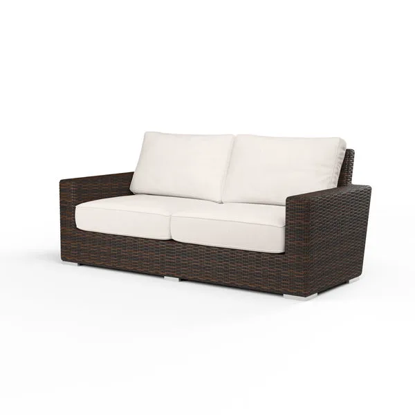 Montecito Loveseat with rich Cognac multi-colored resin wicker frame and white seat and back cushions