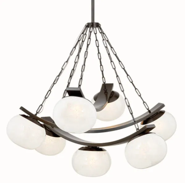 Duxbury Chandelier isolated on white background, side angle showing metal chains and curved bands