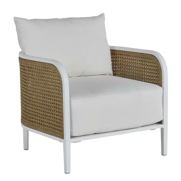 Outdoor lounge chair with white resin frame, natural woven rattan sides, and white cushions