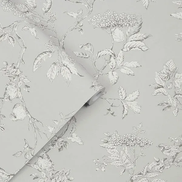 Wallpaper with white botanicals and birds on a steel grey background featuring floral and leaf patterns