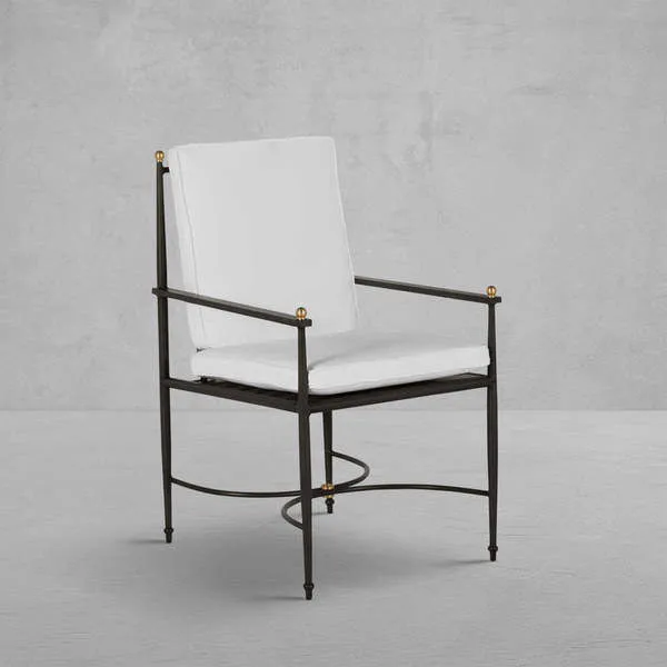 Roma Wrought Aluminum Arm Chair with white cushions, black wrought aluminum frame, and gold accent finials