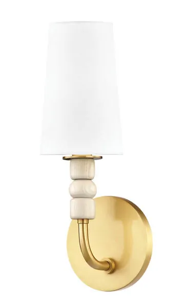 Casey wall sconce from slightly angled front highlighting brass back plate and white shade