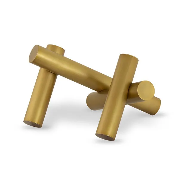 Dion Sculpture composed of four intersecting golden metal cylinders with smooth matte finish
