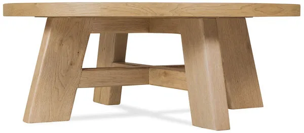 Round Driftwood cocktail table with warm Buckboard finish, X-stretcher base, oak solids and veneers