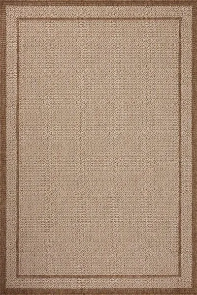 Rectangular indoor/outdoor area rug with a warm rust palette and a clean-lined geometric pattern in chestnut and oatmeal hues
