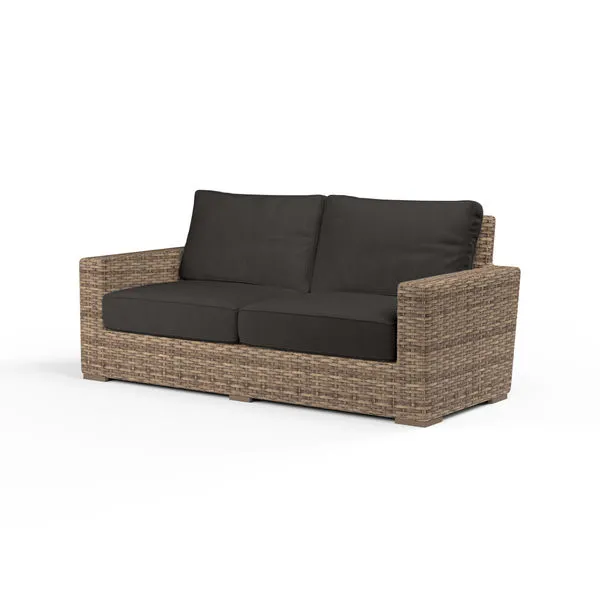 Havana Loveseat outdoor sofa with aged tobacco all-weather wicker frame and dark cushions