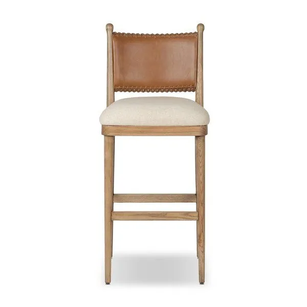 Bar stool with antique walnut frame, mahogany leather backrest with stitching, and natural linen-cotton seat