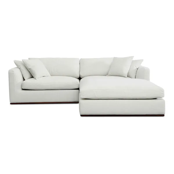 Rue Nook modular sectional sofa with 70% feather-fill toppers, toss cushions, white upholstery, and floating rubber wood base