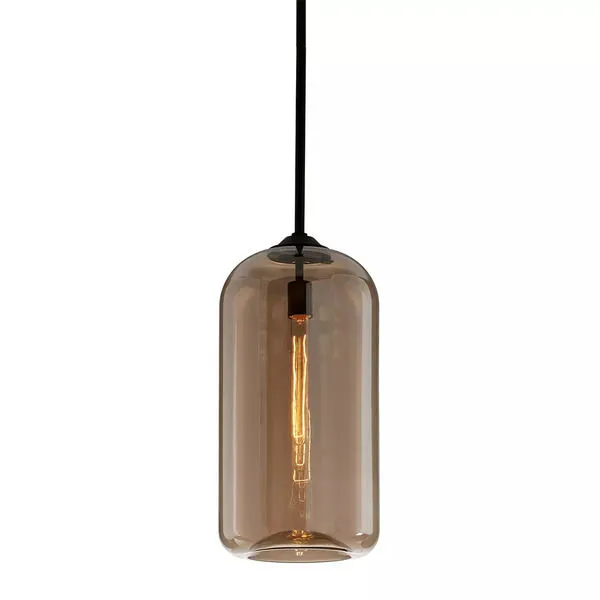 Large amber glass pendant light with cylindrical shape and visible filament bulb hanging from black cord