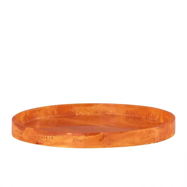 Large round serving tray in vibrant orange resin with smooth glossy finish and raised edges