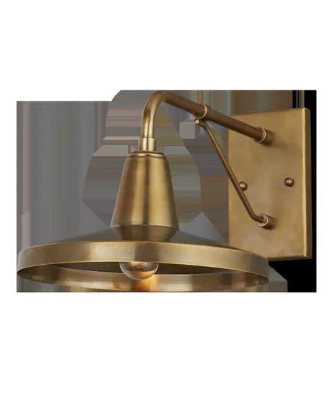 Mariner Outdoor Wall Sconce in antique brass finish with geometric design and wide circular shade
