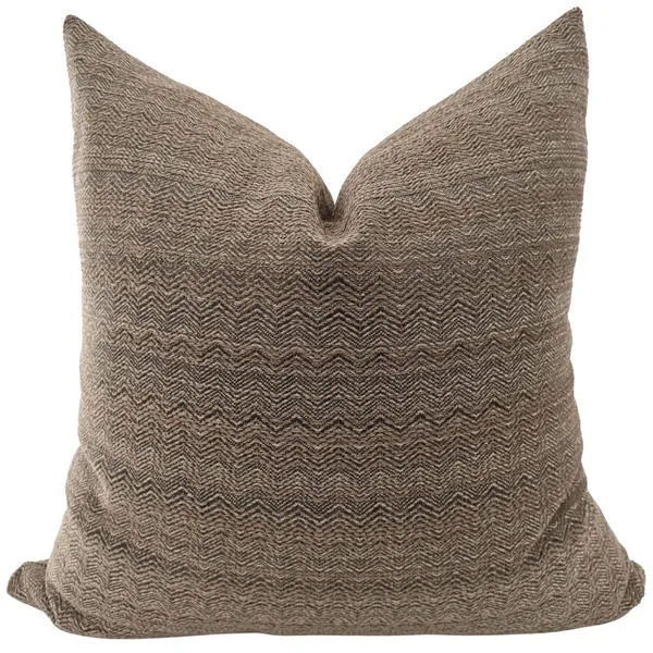 square pillow with textured brown cover featuring subtle chevron pattern in warm cocoa tones