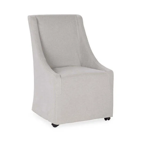 Warwick Upholstered Rolling Dining Chair in neutral gray with sloping arms and castors for mobility