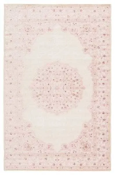 Overhead flat lay showing full rug with distinct pink medallion and floral border detail