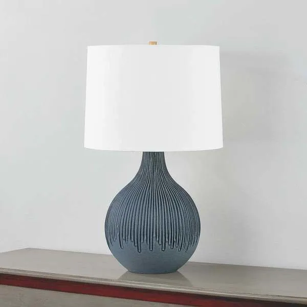 Side angle of Nepperhand table lamp showing the curved gourd-shaped base and shade profile