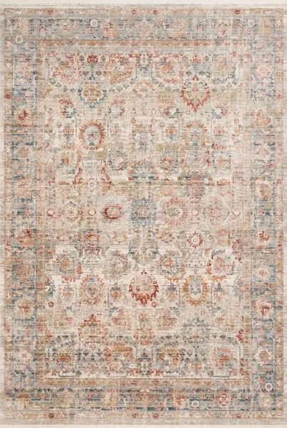 Traditional power-loomed rug with abstract and traditional motifs in ivory, ocean blue, rust, and muted gold tones