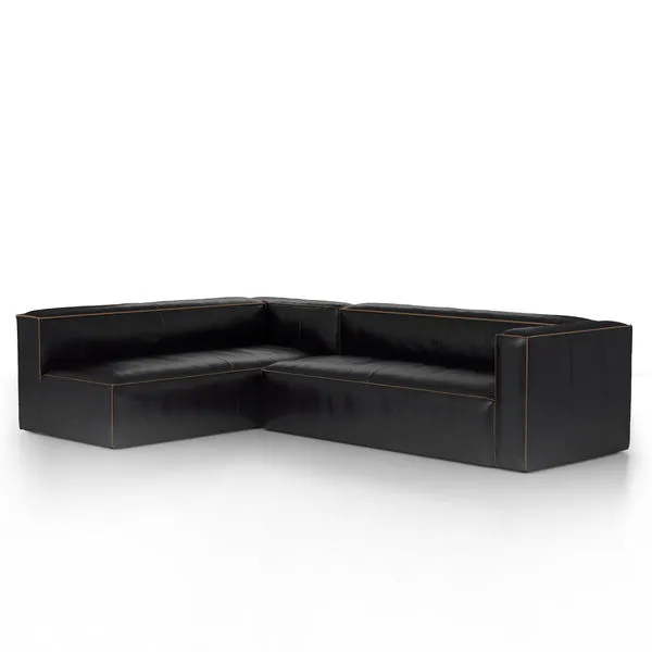 Right-arm facing two-piece black leather sectional with clean lines and contrast stitching