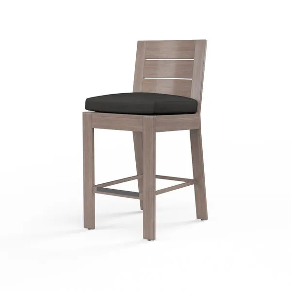 Laguna Counter Stool with a hand-brushed aluminum frame mimicking driftwood and a black cushioned seat
