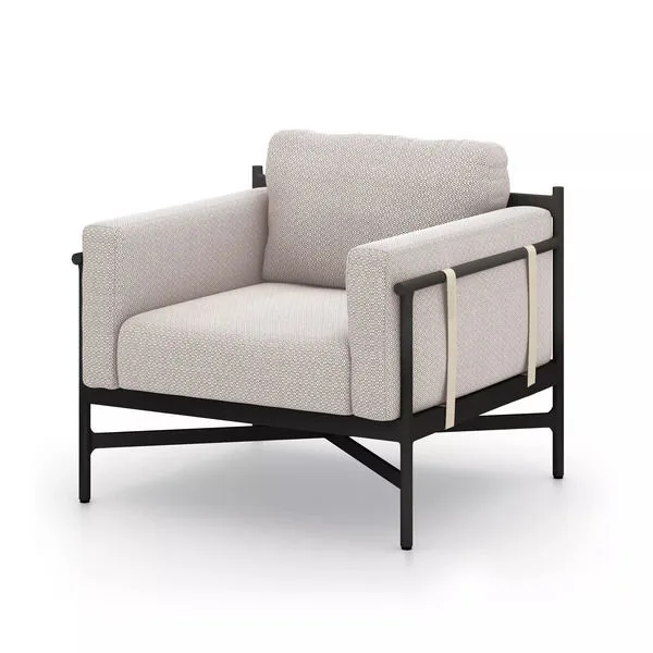 Hearst Outdoor Chair with dark bronze aluminum frame and light sand cushioned seating with ivory strapping on sides