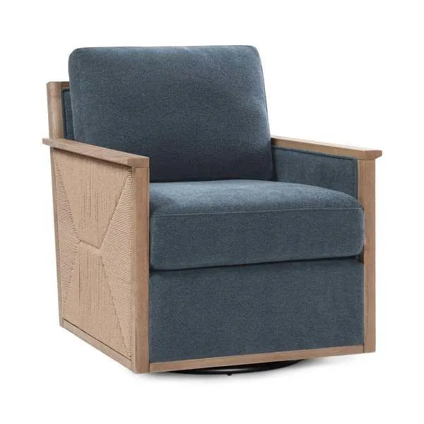 Norman Swivel Accent Chair with blue linen-like upholstery, boxy silhouette, natural wood frame, and plump cushions