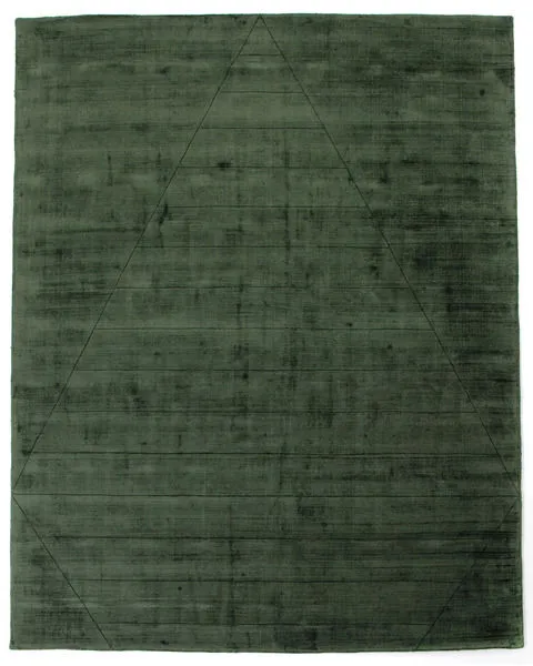 Soft green area rug with subtle tonal triangle pattern and smooth hand-carved texture
