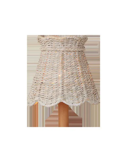 Whitewashed seagrass tapered chandelier shade with scalloped bottom edge on a wooden base