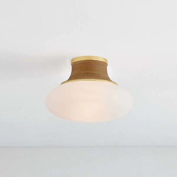 Pearl River flush mount ceiling light installed on white ceiling, glowing soft warm light