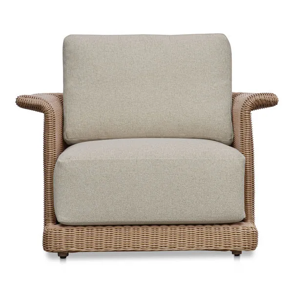 Meredith Outdoor Accent Chair with tulip silhouette, woven synthetic wicker over aluminum frame, and beige cushioned seat ...
