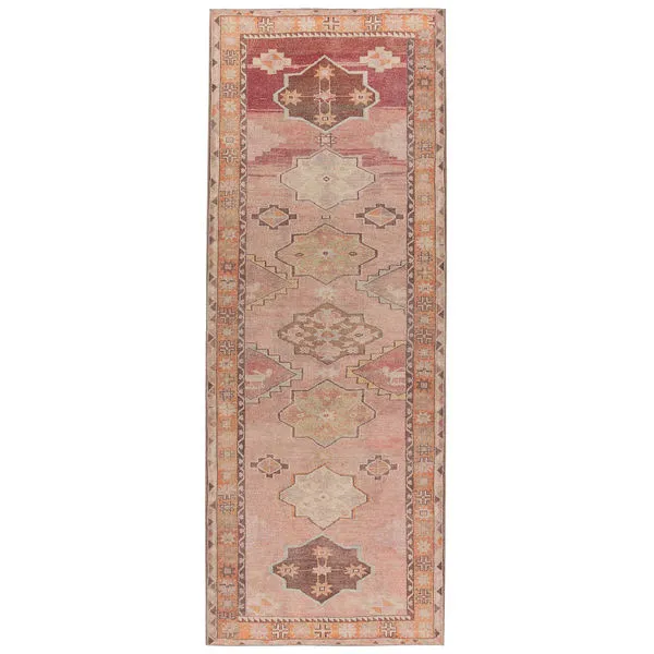 4x8 foot Southwestern rug with mini-medallions and geometric borders in orange, pink, beige, and brown