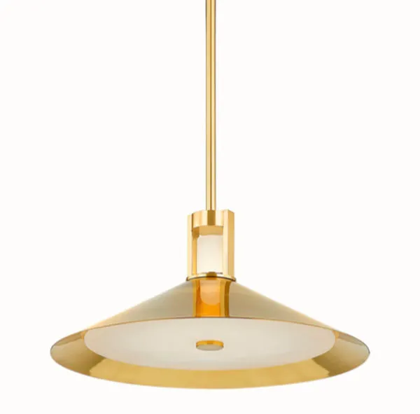 Clermont Pendant close-up with focused lighting accentuating brass shade's glossy finish and alabaster diffuser