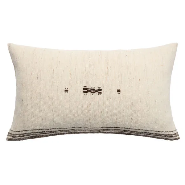 Rectangular cream wool pillow with subtle horizontal stripes, brown embroidered center, and button details