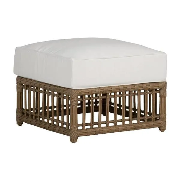 Newport woven ottoman with natural wicker base and white cushioned top for outdoor seating