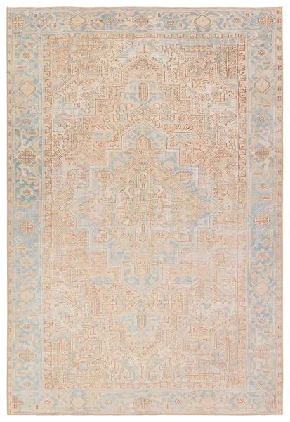 Beige and blue vintage style rug with a center medallion and intricate tribal and floral border