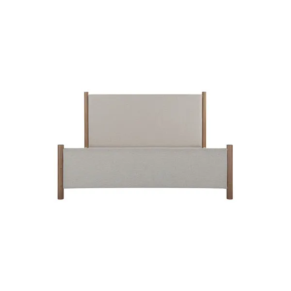 Warren Bed with four-post rubberwood frame in midtone brown and a plush beige upholstered headboard