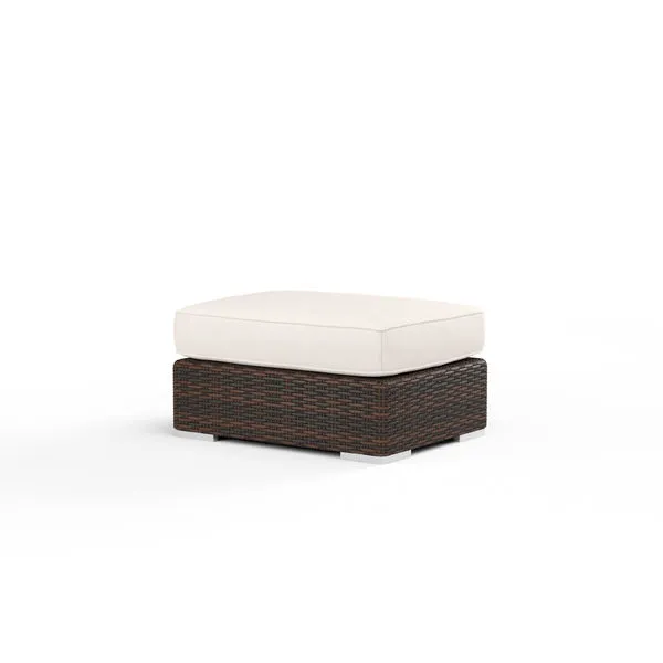 Montecito outdoor ottoman with Cognac multi-colored resin wicker base and thick off-white cushion
