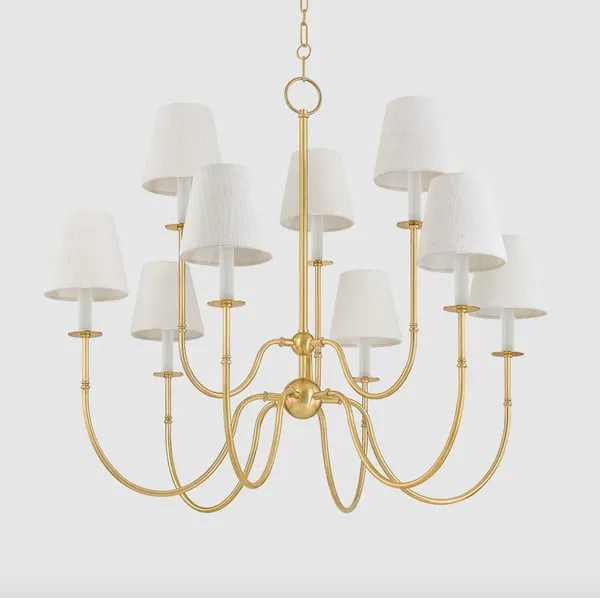 Side angle of Amina Chandelier highlighting curved J-arms and detailed brass finish