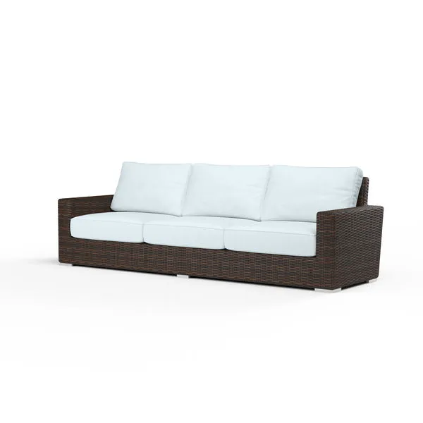 Montecito Sofa with cognac multi-colored virgin resin wicker frame and white seat and back cushions