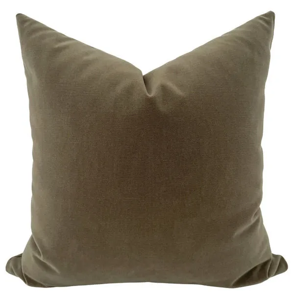 Olive green velvet pillow cover with a soft, smooth texture and a slightly pointed top corner