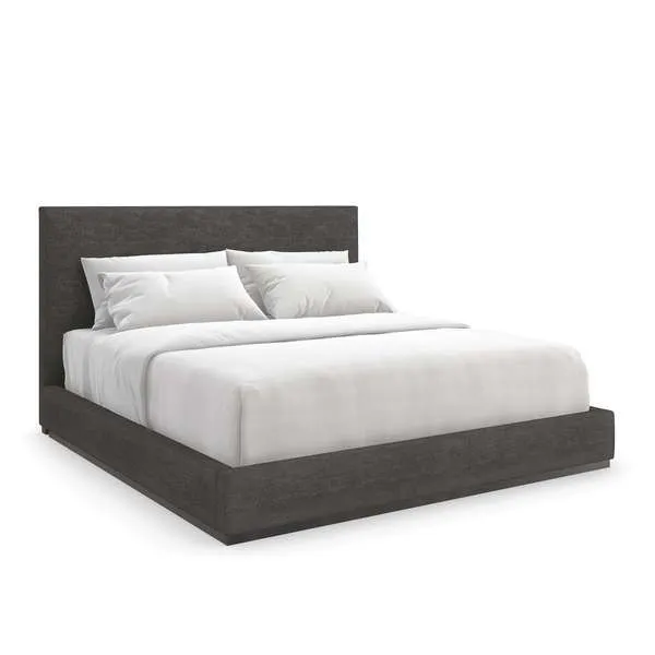 Modern dark gray upholstered platform bed with tall rectangular headboard and white bedding