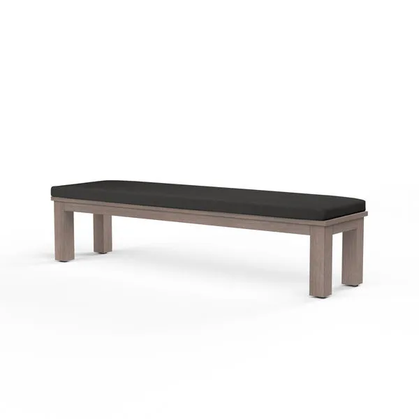 Laguna Dining Bench with hand-brushed aluminum frame mimicking driftwood and black cushioned seat