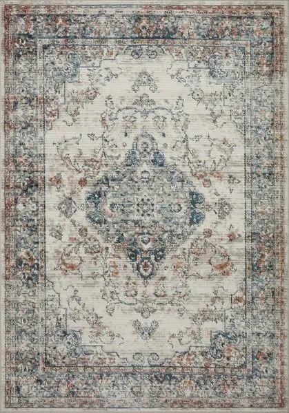 Bianca Ivory Ocean Rug with distressed traditional medallion pattern in ivory, blue, and rust tones