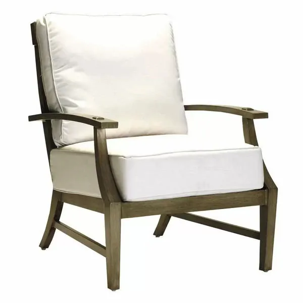 Outdoor lounge chair with aluminum mahogany frame and thick white cushions on seat and back
