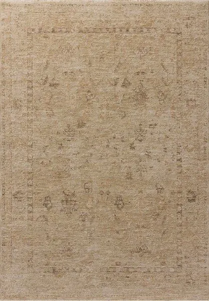 Willa Wheat traditional area rug with subtle Turkish motifs in sand and pale sky tones on a vintage-style neutral background